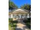 Well-maintained clubhouse with manicured landscaping, stone accents, and a welcoming entrance for community members at 112 Crown Oaks Way # 112, Longwood, FL 32779