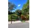 Community bridge, lush green landscape, and clear blue skies, inviting for nature walks at 112 Crown Oaks Way # 112, Longwood, FL 32779
