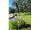 Community park featuring lush greenery, a pond, and a walking path at 112 Crown Oaks Way # 112, Longwood, FL 32779
