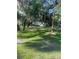 Lush green park with mature trees, Spanish moss, manicured lawns, and community seating areas at 112 Crown Oaks Way # 112, Longwood, FL 32779