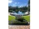 Scenic view of the community's natural springs with lush landscaping and clear blue waters at 112 Crown Oaks Way # 112, Longwood, FL 32779