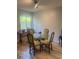 Bright dining area with glass top table and stylish chairs at 112 Crown Oaks Way # 112, Longwood, FL 32779