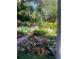 Lush community gardens featuring a brick path, colorful flowers, and tropical plants for a relaxing atmosphere at 112 Crown Oaks Way # 112, Longwood, FL 32779