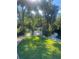 Charming white gazebo nestled in a serene, landscaped park setting at 112 Crown Oaks Way # 112, Longwood, FL 32779
