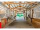 Interior of horse stable with multiple stalls featuring wooden construction and an open-air design for optimal ventilation at 112 Crown Oaks Way # 112, Longwood, FL 32779