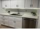 Updated kitchen showcasing bright white cabinets, a stainless steel sink, and modern countertops at 112 Crown Oaks Way # 112, Longwood, FL 32779