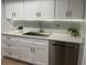 Modern kitchen with white cabinets, stainless steel appliances, granite countertop, and under cabinet lighting at 112 Crown Oaks Way # 112, Longwood, FL 32779