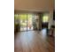 Bright living room with ample natural light and a view to a private outdoor area at 112 Crown Oaks Way # 112, Longwood, FL 32779