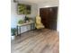 Cozy living space featuring hard wood floors, a decorative table, and comfortable seating at 112 Crown Oaks Way # 112, Longwood, FL 32779