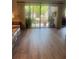 Light filled living room features new floors and large sliding glass doors with access to outdoor space at 112 Crown Oaks Way # 112, Longwood, FL 32779
