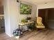 Inviting living space with hardwood floors, stylish decor, and a mounted TV at 112 Crown Oaks Way # 112, Longwood, FL 32779