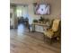 Inviting living space featuring hard wood floors, an adjacent dining area, and comfortable seating at 112 Crown Oaks Way # 112, Longwood, FL 32779