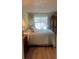 Cozy main bedroom features lots of natural light and a large window view at 112 Crown Oaks Way # 112, Longwood, FL 32779