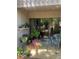 Charming patio with plants, outdoor seating, and a view of the peaceful surroundings at 112 Crown Oaks Way # 112, Longwood, FL 32779