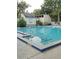 Community swimming pool with shallow area and steps for access at 112 Crown Oaks Way # 112, Longwood, FL 32779