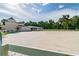 Exterior view of the riding arena with a well-maintained surface and a white perimeter fence at 112 Crown Oaks Way # 112, Longwood, FL 32779