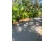 Roadside view shows lush, mature palms adding natural beauty to the landscape in this tropical location at 112 Crown Oaks Way # 112, Longwood, FL 32779