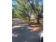 Shaded street view with mature trees lining the roadway at 112 Crown Oaks Way # 112, Longwood, FL 32779