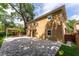 Spacious backyard featuring a large patio, pergola, lush lawn, and a private fence, perfect for outdoor living at 1130 Hardy Ave, Orlando, FL 32803