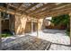 Wide backyard paver patio features a pergola cover, access to the house, and green grass at 1130 Hardy Ave, Orlando, FL 32803