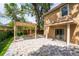 Spacious backyard featuring a pergola, a patio and large trees for shade at 1130 Hardy Ave, Orlando, FL 32803