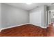 Bedroom features wood flooring, a closet and neutral walls at 1130 Hardy Ave, Orlando, FL 32803