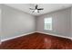 Bright bedroom with wood flooring, ceiling fan and a window at 1130 Hardy Ave, Orlando, FL 32803