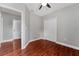 Bedroom with wood flooring, ceiling fan, and ensuite access at 1130 Hardy Ave, Orlando, FL 32803