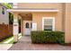 Exterior view of home entrance with brick walkway and manicured landscaping at 1130 Hardy Ave, Orlando, FL 32803