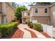 Beautiful two-story townhome with neutral exterior and a brick driveway entrance at 1130 Hardy Ave, Orlando, FL 32803