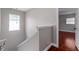 Bright hallway showcasing hardwood floors and a window for natural light at 1130 Hardy Ave, Orlando, FL 32803