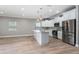 Open kitchen with island, new appliances, and ample light at 1130 Hardy Ave, Orlando, FL 32803