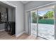 Laundry room with washing machine and access to an outdoor patio at 1130 Hardy Ave, Orlando, FL 32803