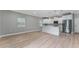 Open living area with recessed lighting next to kitchen and slider to the backyard at 1130 Hardy Ave, Orlando, FL 32803