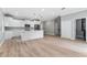 Open living area leads to the kitchen with stainless steel appliances and a center island at 1130 Hardy Ave, Orlando, FL 32803