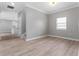 Open-concept living room showing staircase and kitchen at 1130 Hardy Ave, Orlando, FL 32803
