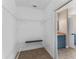 Spacious walk-in closet with white wire shelving and access to the ensuite bathroom at 1130 Hardy Ave, Orlando, FL 32803