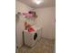 Functional laundry room featuring a washer and dryer with decor at 119 Stewart Lake Loop, Groveland, FL 34736