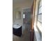 Bathroom showcases a sink, mirror, and a door leading into the bedroom at 123 N High St, Lake Mary, FL 32746