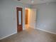 Bedroom boasts neutral walls, baseboard, and two doors with a connecting hallway at 123 N High St, Lake Mary, FL 32746