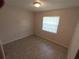 Bedroom with neutral walls, window with blinds, and overhead lighting at 123 N High St, Lake Mary, FL 32746