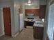 Well-lit kitchen includes standard appliances and cabinetry, providing functionality and convenience at 123 N High St, Lake Mary, FL 32746