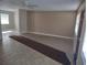 Neutral living room offering a versatile space with easy access to adjoining rooms and ample lighting at 123 N High St, Lake Mary, FL 32746