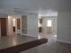 Open living room leading to the kitchen, with a practical layout and neutral color scheme at 123 N High St, Lake Mary, FL 32746