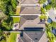 An aerial view highlights the home's backyard, which has a patio, an outdoor fire pit and manicured landscaping at 1232 Turnbridge Pl, Oviedo, FL 32765