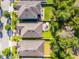 Aerial view displaying the property within a neighborhood setting, showcasing its backyard patio at 1232 Turnbridge Pl, Oviedo, FL 32765