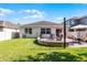 Backyard features a patio, fire pit, dining area, and lush grass at 1232 Turnbridge Pl, Oviedo, FL 32765