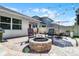Backyard with a fire pit, patio, seating, and outdoor lighting at 1232 Turnbridge Pl, Oviedo, FL 32765