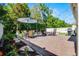 Spacious backyard patio with dining area, outdoor grill, and fire pit, ideal for entertaining guests at 1232 Turnbridge Pl, Oviedo, FL 32765