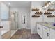 Bathroom featuring a glass enclosed shower and double sink vanity at 1232 Turnbridge Pl, Oviedo, FL 32765